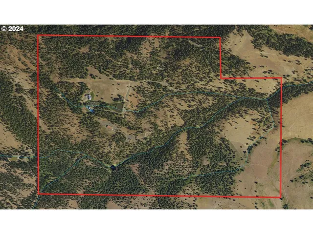 a view of a house with a big yard