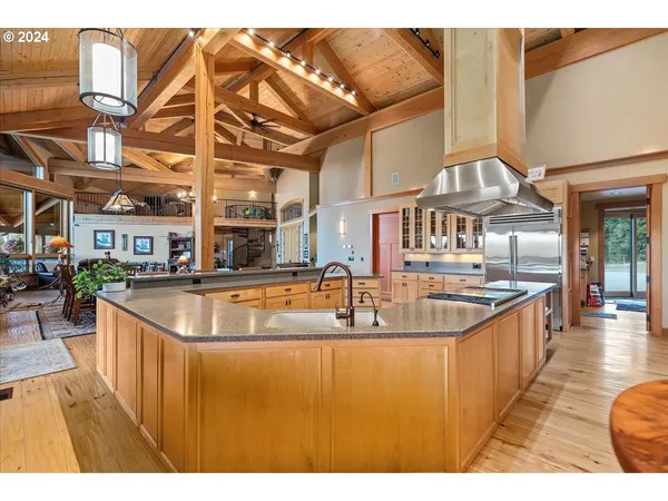 a living room with furniture a large window and a flat tv screen