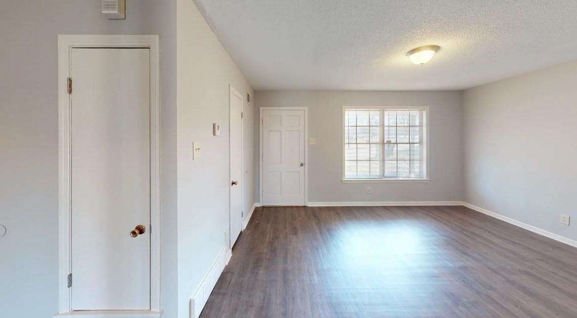 4146 Crain Road Memphis, TN 38128 - Photo 11 of 13 wooden floor in an empty room with a window