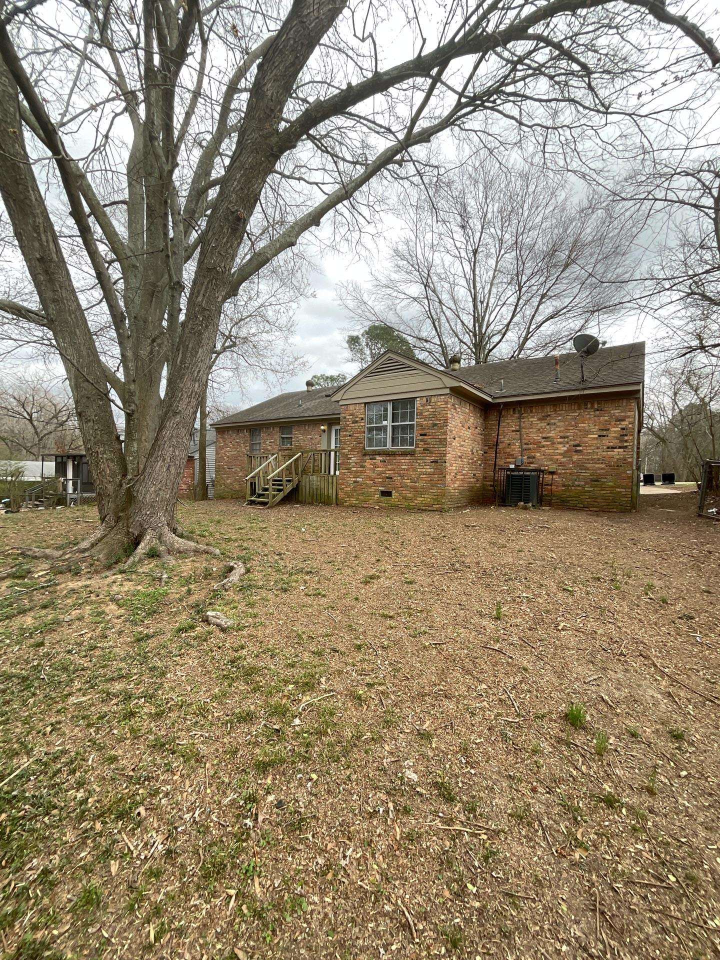 4146 Crain Road Memphis, TN 38128 - Photo 13 of 13 a view of a house with a yard covered in snow