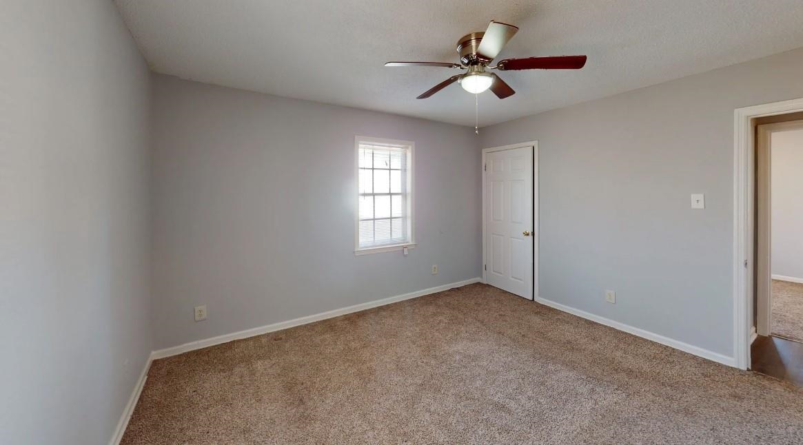 4146 Crain Road Memphis, TN 38128 - Photo 4 of 13 a view of an empty room with a window
