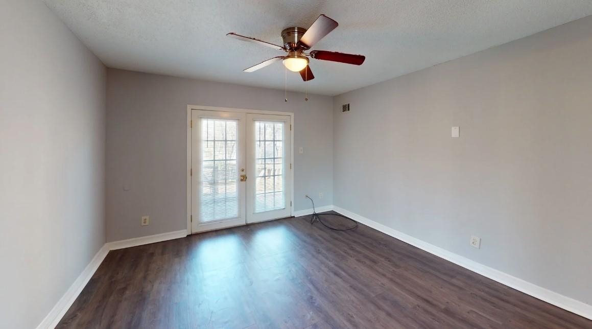 4146 Crain Road Memphis, TN 38128 - Photo 8 of 13 a view of an empty room with wooden floor and a window