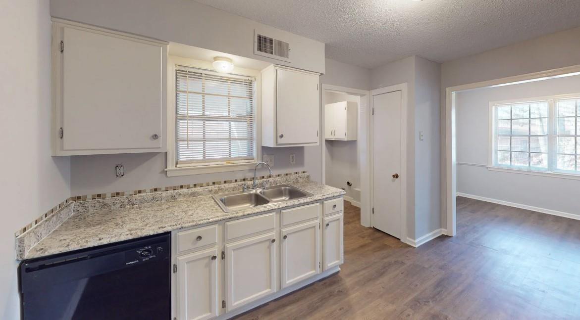 4146 Crain Road Memphis, TN 38128 - Photo 10 of 13 a kitchen with a sink stove and cabinets