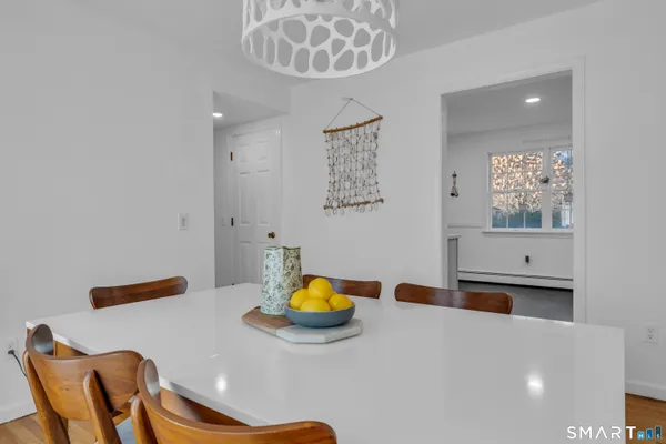 a bedroom with a bed and a lamp on table