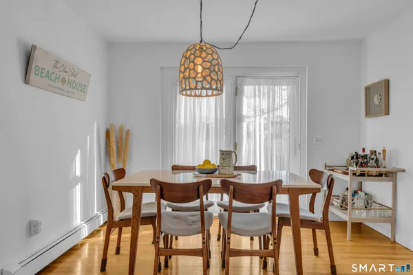 a dining room with furniture and window