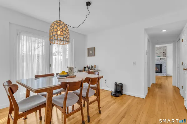 a view of a dining room with furniture window and outside view