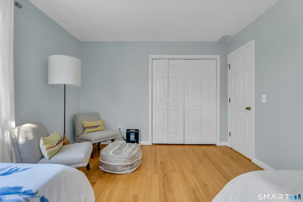 a bedroom with bed and a window