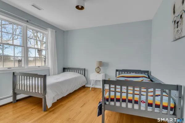 a bedroom with bed and a couch