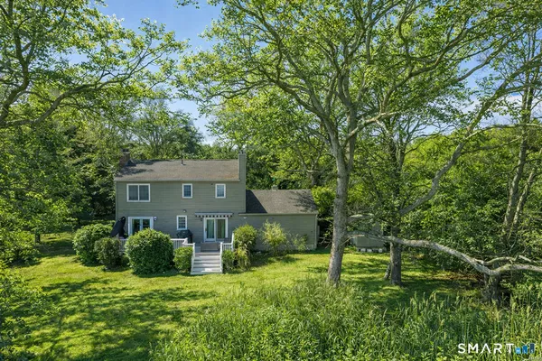 a view of a house with a big yard