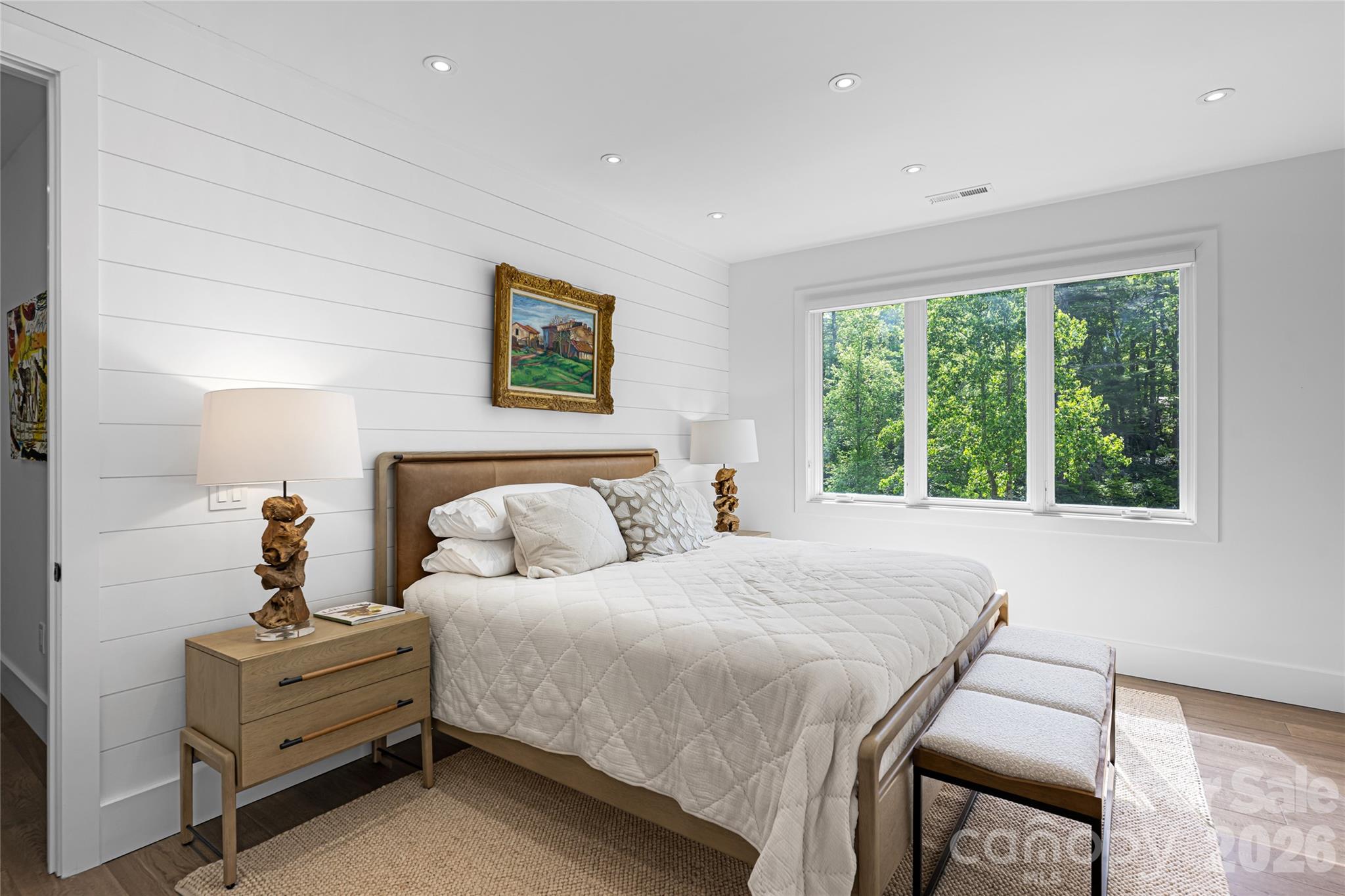 2235 Cold Mountain Road Lake Toxaway, NC 28747 - Photo 33 of 47 a bedroom with a bed and a painting on the wall