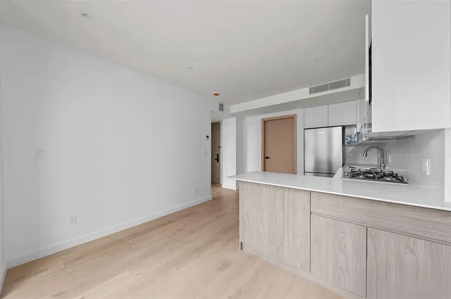 a kitchen with white cabinets