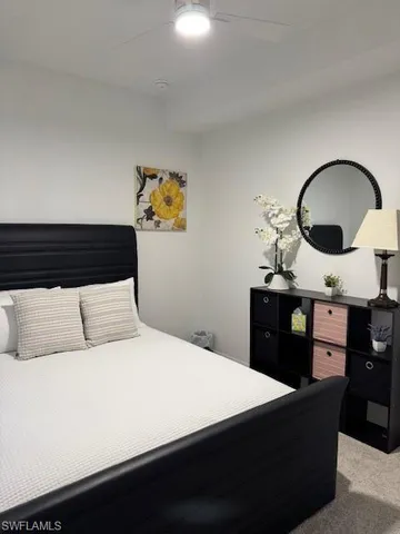 a bedroom with a bed and cabinets