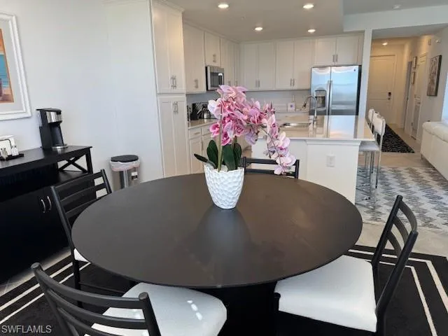 a room with furniture and potted plant