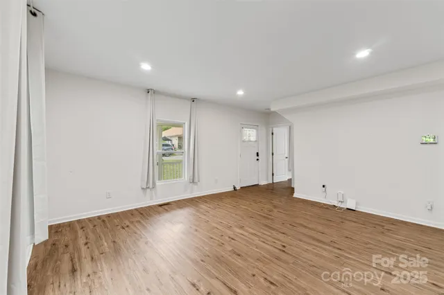wooden floor in an empty room with window