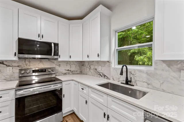 a kitchen with a stove and a sink
