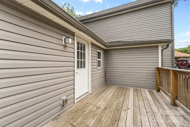 a view of a balcony with white wall
