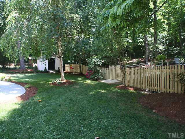629 Macon Place Raleigh, NC 27609 - Photo 11 of 12 Brand new fence with awesome walk-way across the brook to more backyard.