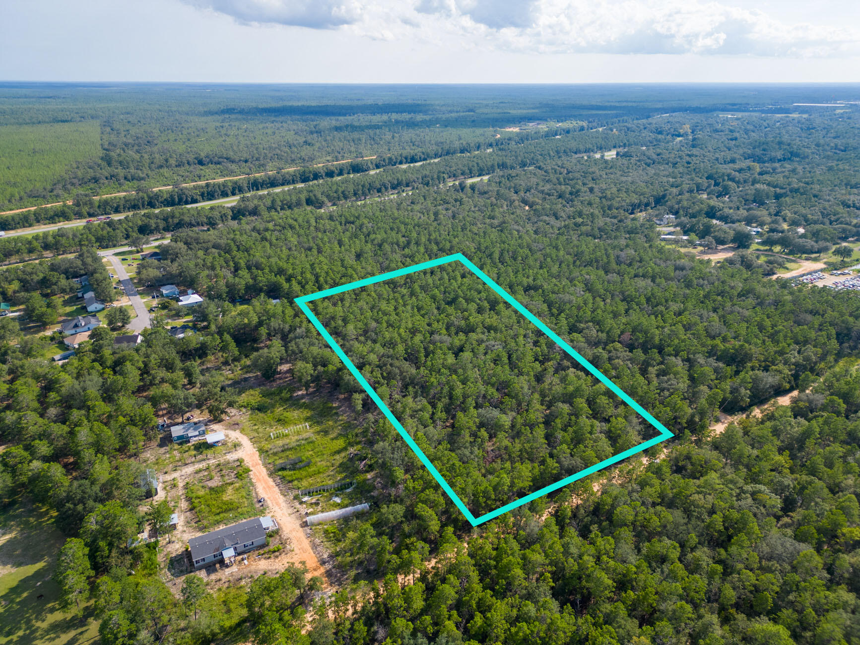 5-acres Carol Lane DeFuniak Springs, FL 32433 - Photo 5 of 10 an aerial view of house with yard