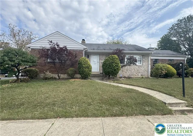 front view of a house with a yard