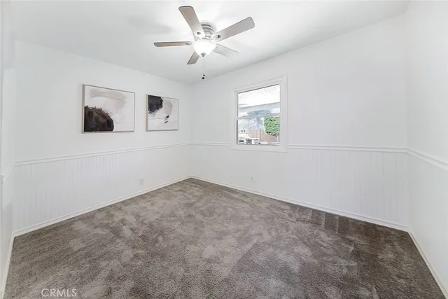 a view of house with backyard and seating space