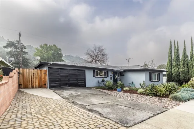 a front view of a house with a garage