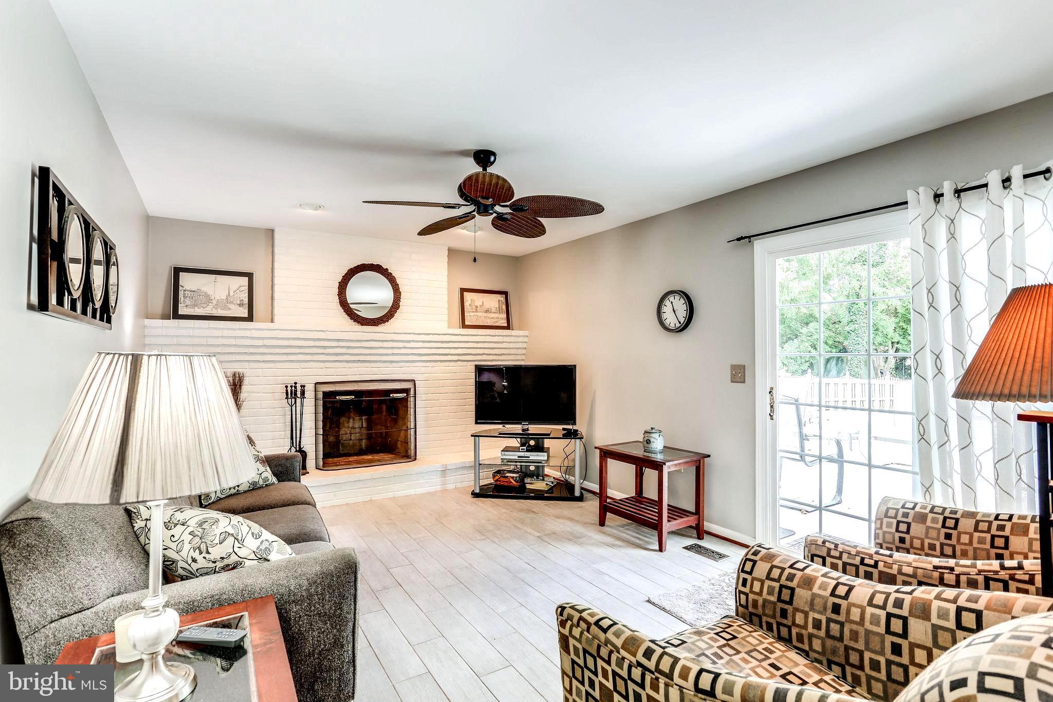708 Washington Road Westminster, MD 21157 - Photo 22 of 46 Family Room with Wood Burning Fireplace & Slider