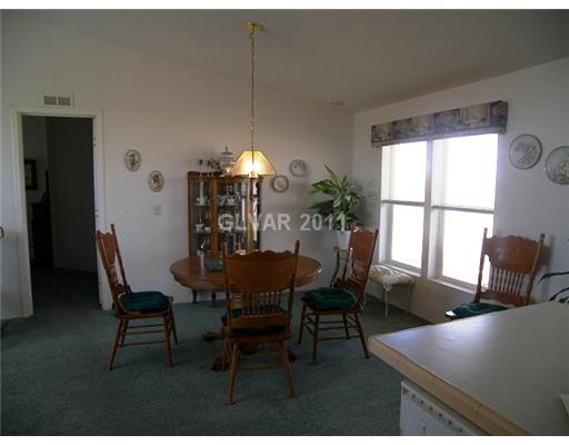 5560 Doubletree Road Pahrump, NV 89061 - Photo 15 of 25 Dining Room. Spacious dining area has room for a large hutch.