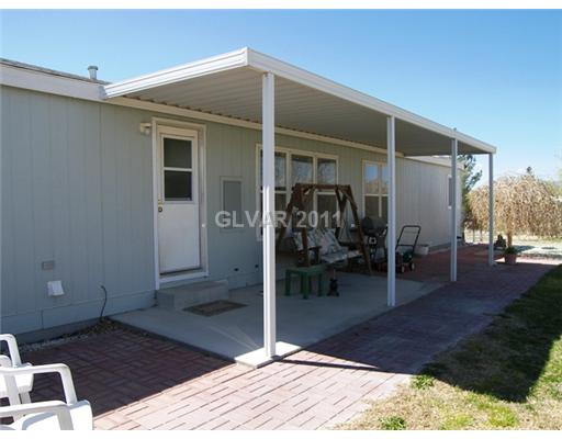 5560 Doubletree Road Pahrump, NV 89061 - Photo 17 of 25 Patio/Deck. Aluminum patio cover is approved for FHA financing. Paving brick extend the patio area.