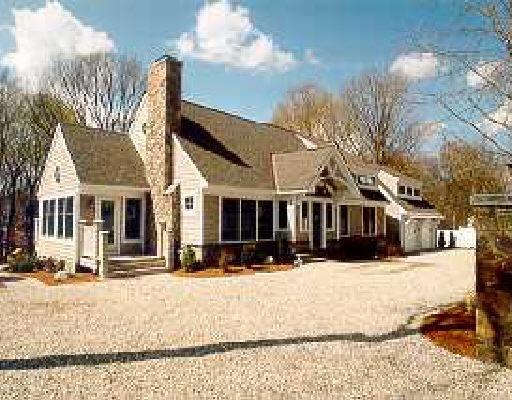 186 B Compo Road South Westport, CT 06880 - Photo 1 of 1 a front view of a house with a yard covered in snow