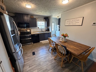 310 Nebo Church Road Seneca, SC 29678 - Photo 6 of 27 This inviting eat-in kitchen features sleek appliances and ample space for dining.