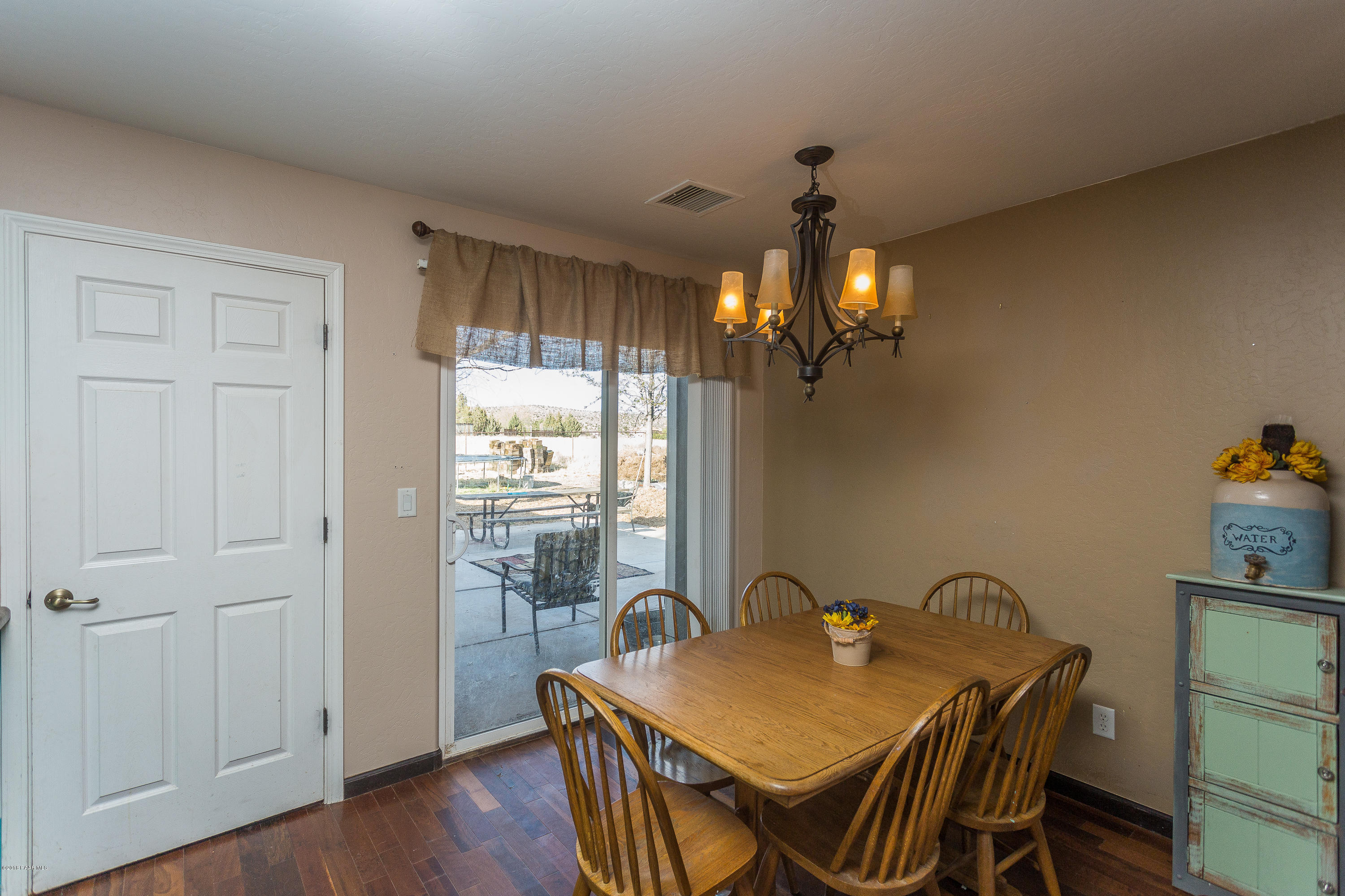 25805 Poppy Road Paulden, AZ 86334 - Photo 6 of 17 a dining room with furniture and wooden floor