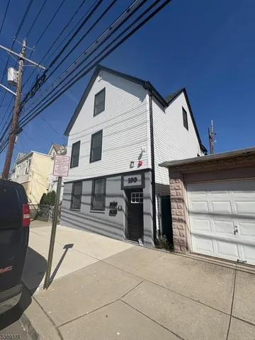 a view of a car park in front of house