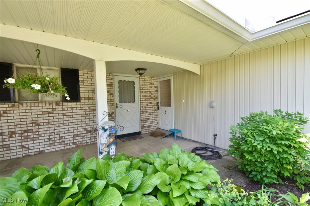 8955 West Ridge Road, Unit D Elyria, OH 44035 - Photo 2 of 33 Property entrance with brick siding and covered porch