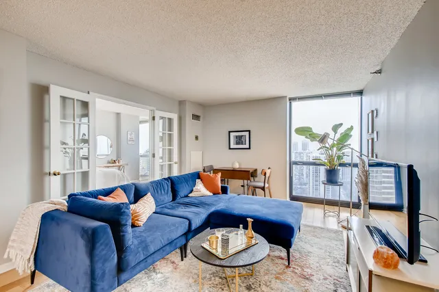 a living room with furniture and a window