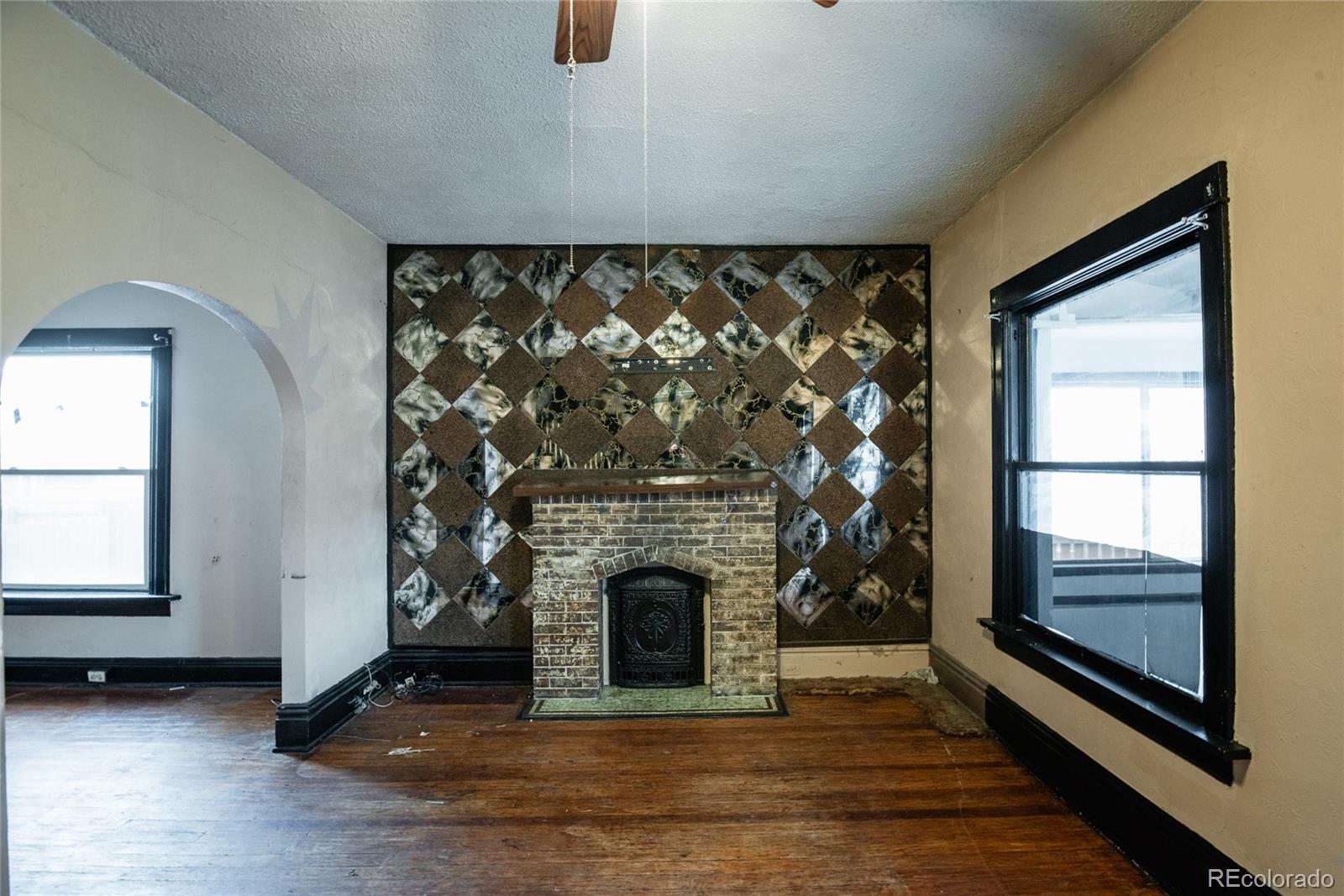 662 South Logan Street Denver, CO 80209 - Photo 11 of 25 a living room with a fireplace