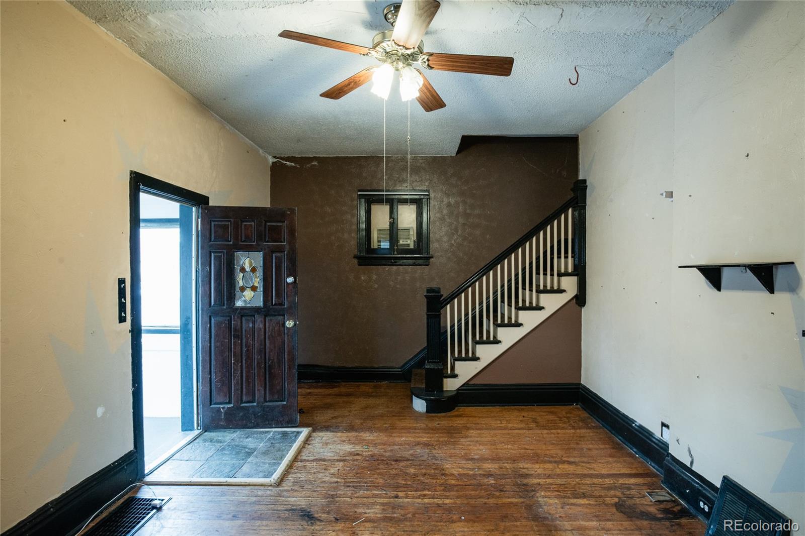 662 South Logan Street Denver, CO 80209 - Photo 13 of 25 a view of entryway and hall with wooden floor