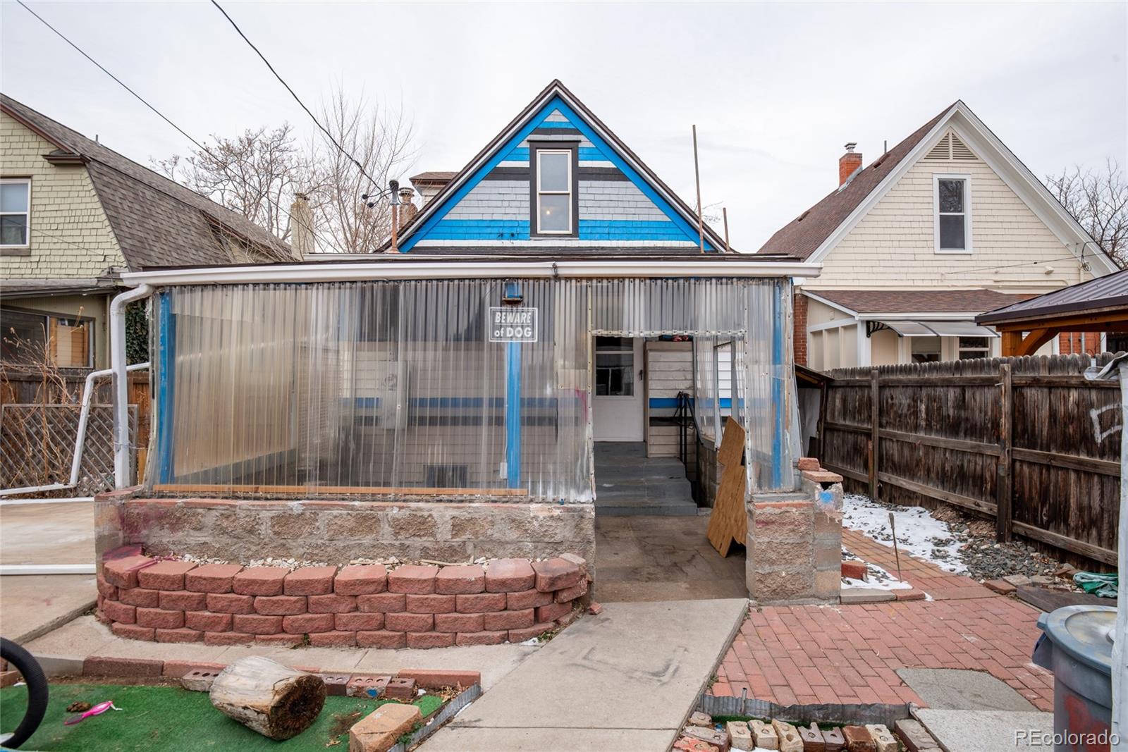 662 South Logan Street Denver, CO 80209 - Photo 24 of 25 a front view of a house with garden