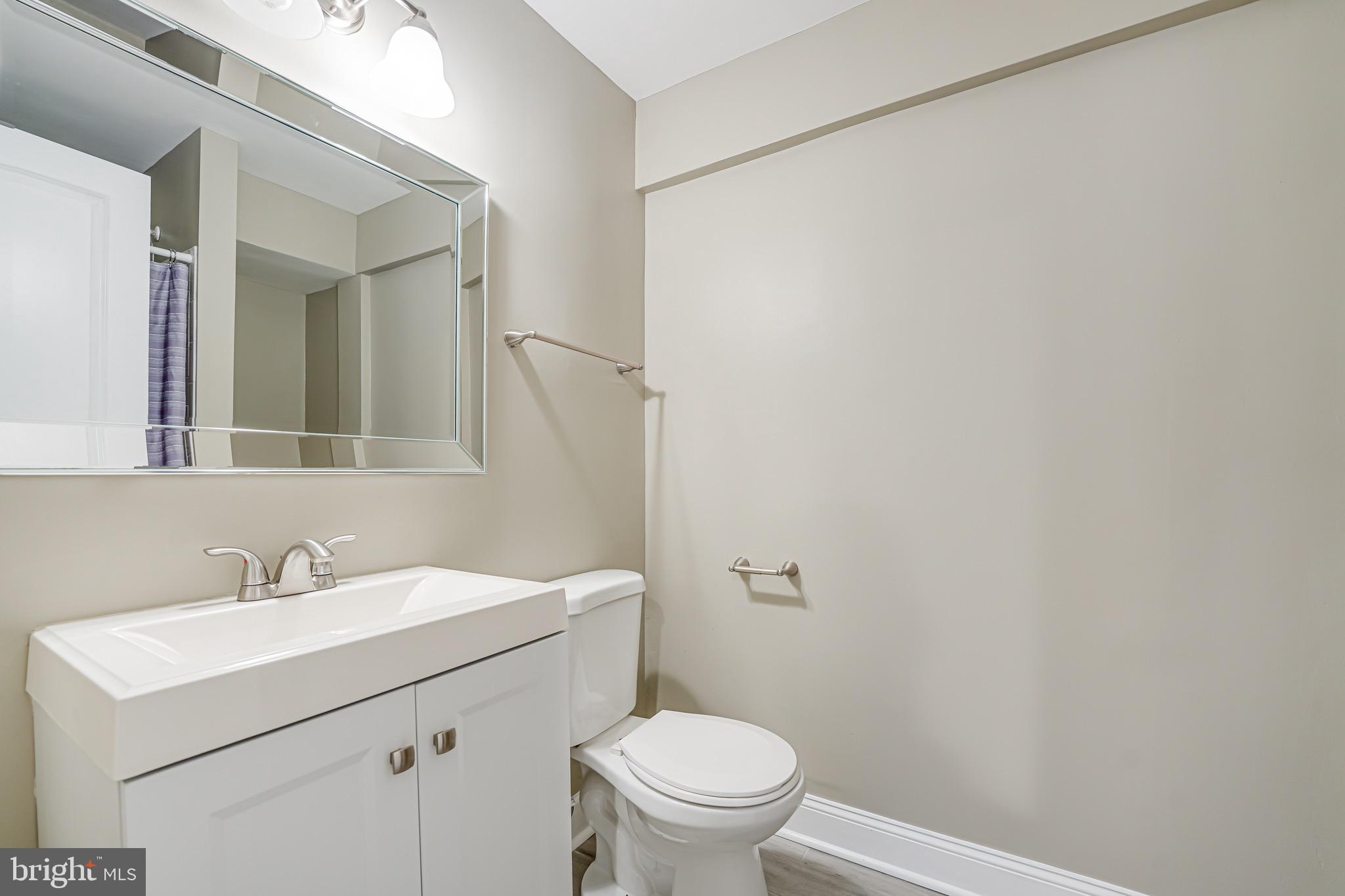 15592 Northgate Drive Dumfries, VA 22025 - Photo 16 of 51 a bathroom with a sink mirror vanity and toilet