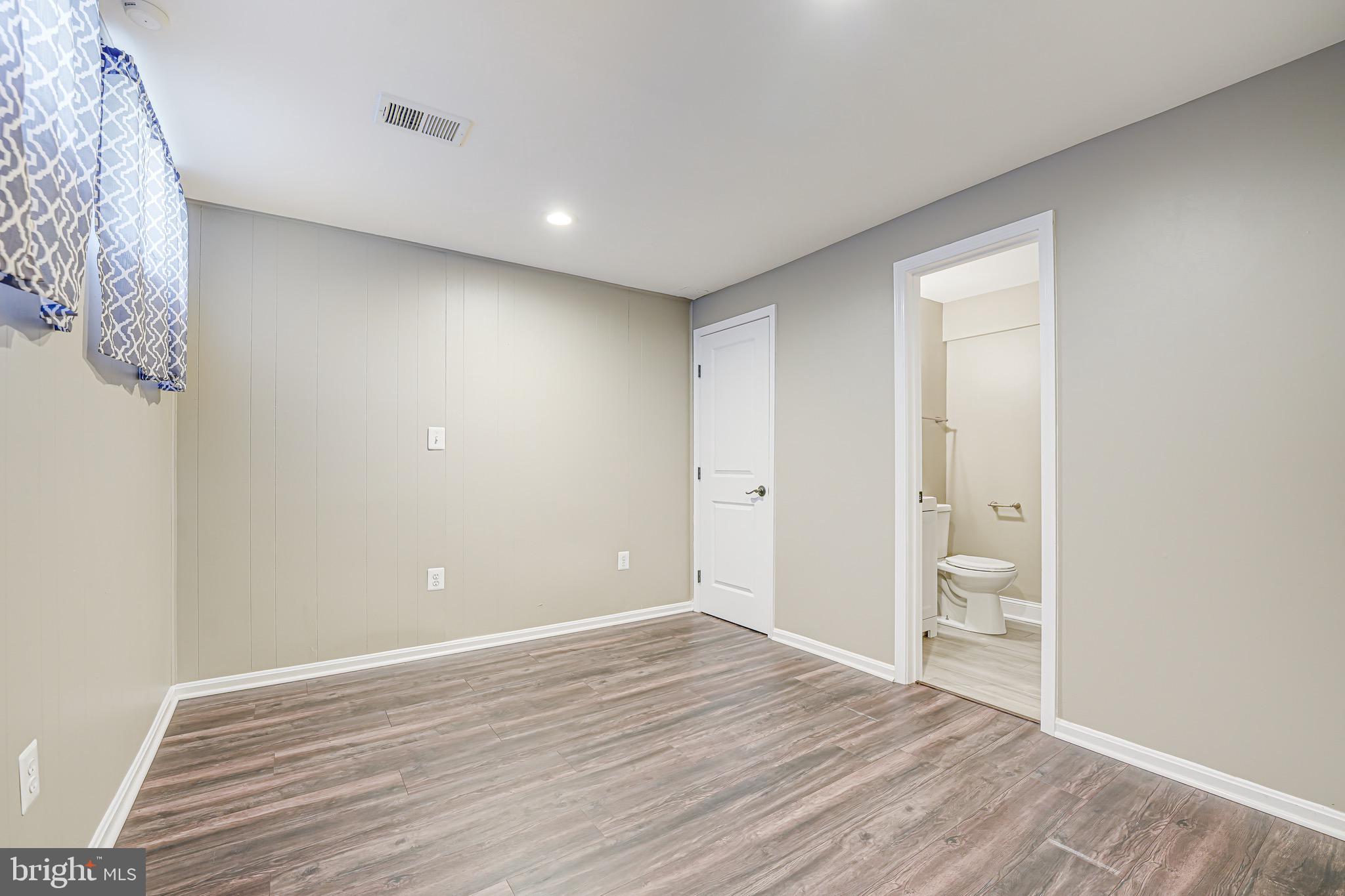 15592 Northgate Drive Dumfries, VA 22025 - Photo 21 of 51 a view of an empty room with wooden floor