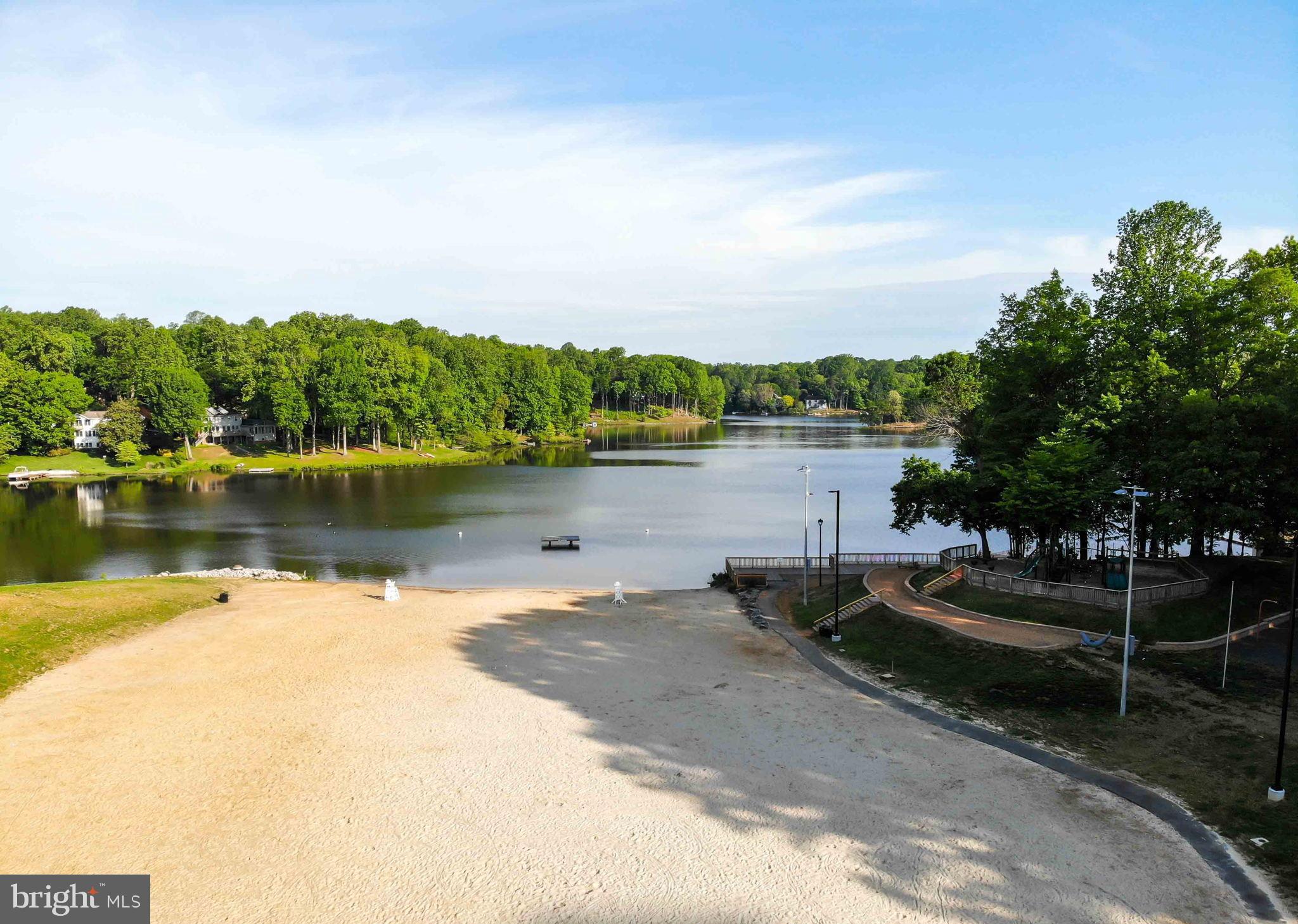 15592 Northgate Drive Dumfries, VA 22025 - Photo 34 of 51 a view of a lake with houses in the background