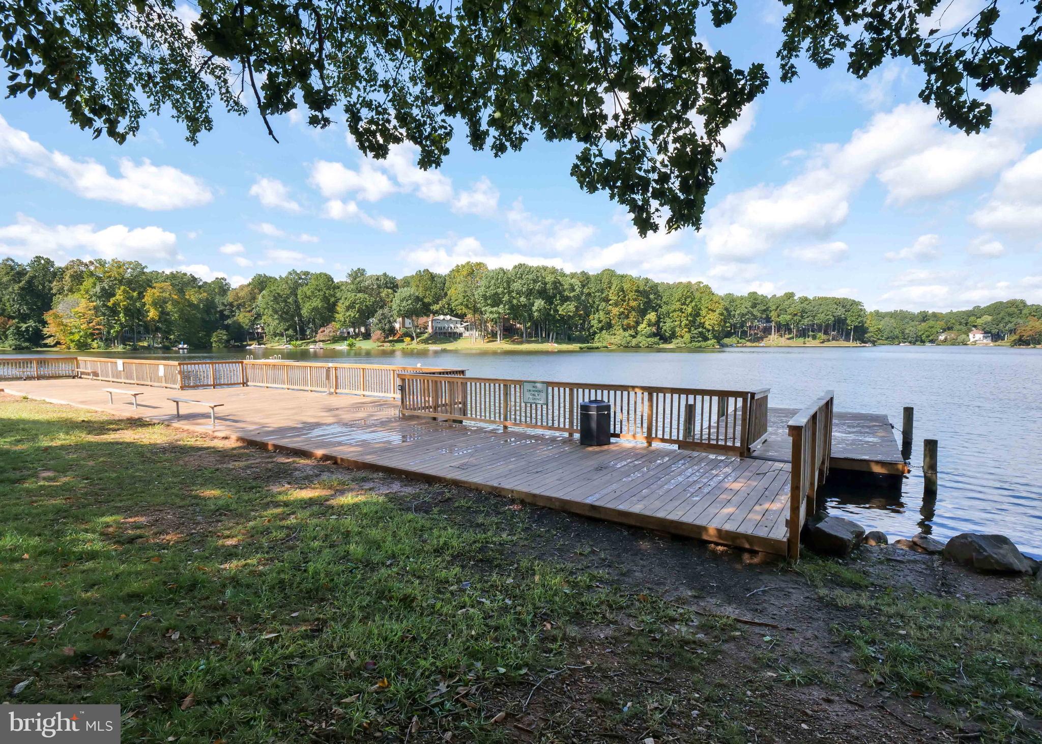 15592 Northgate Drive Dumfries, VA 22025 - Photo 40 of 51 a backyard of a house with table and chairs