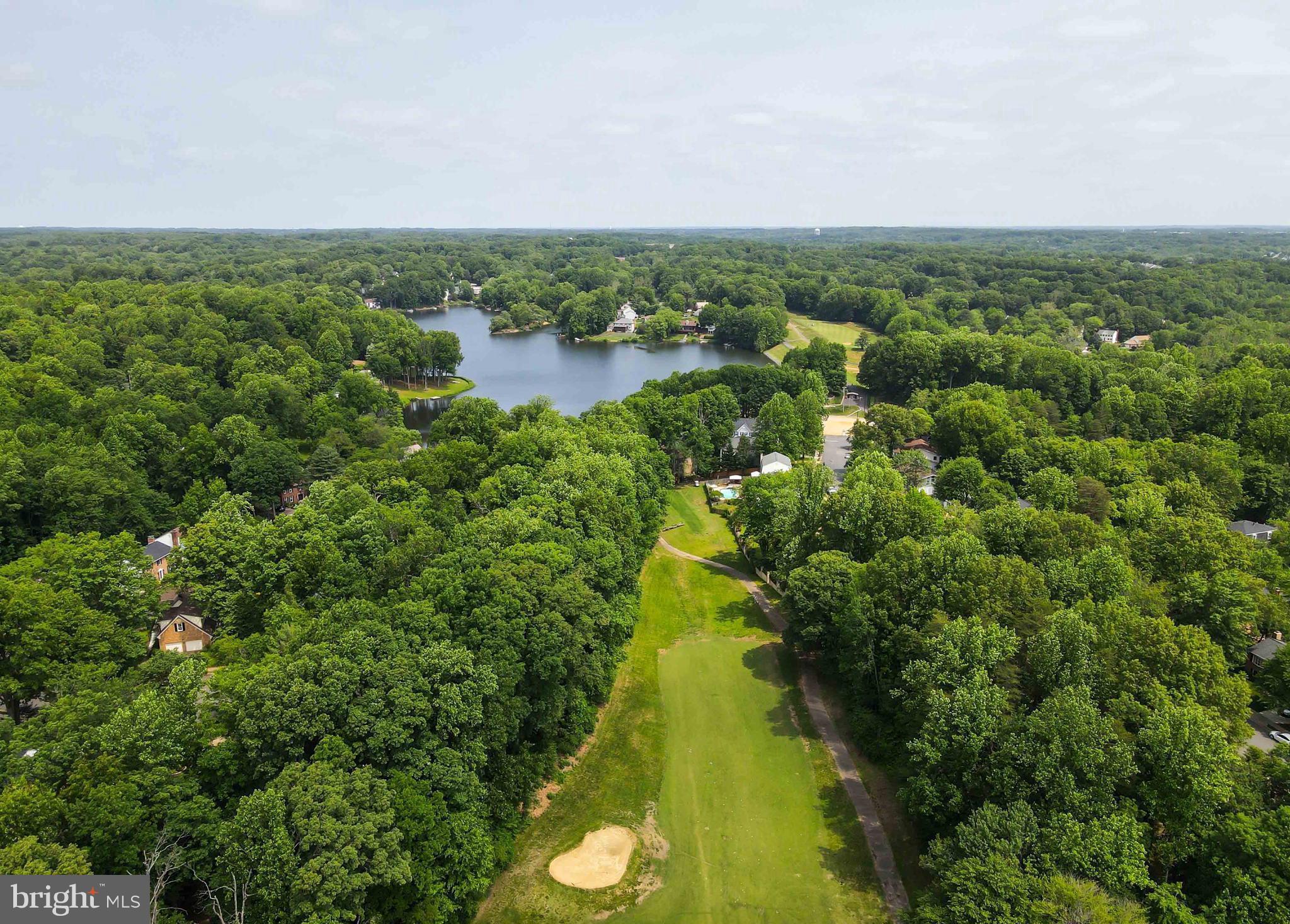 15592 Northgate Drive Dumfries, VA 22025 - Photo 44 of 51 a view of a lake with plants and large trees