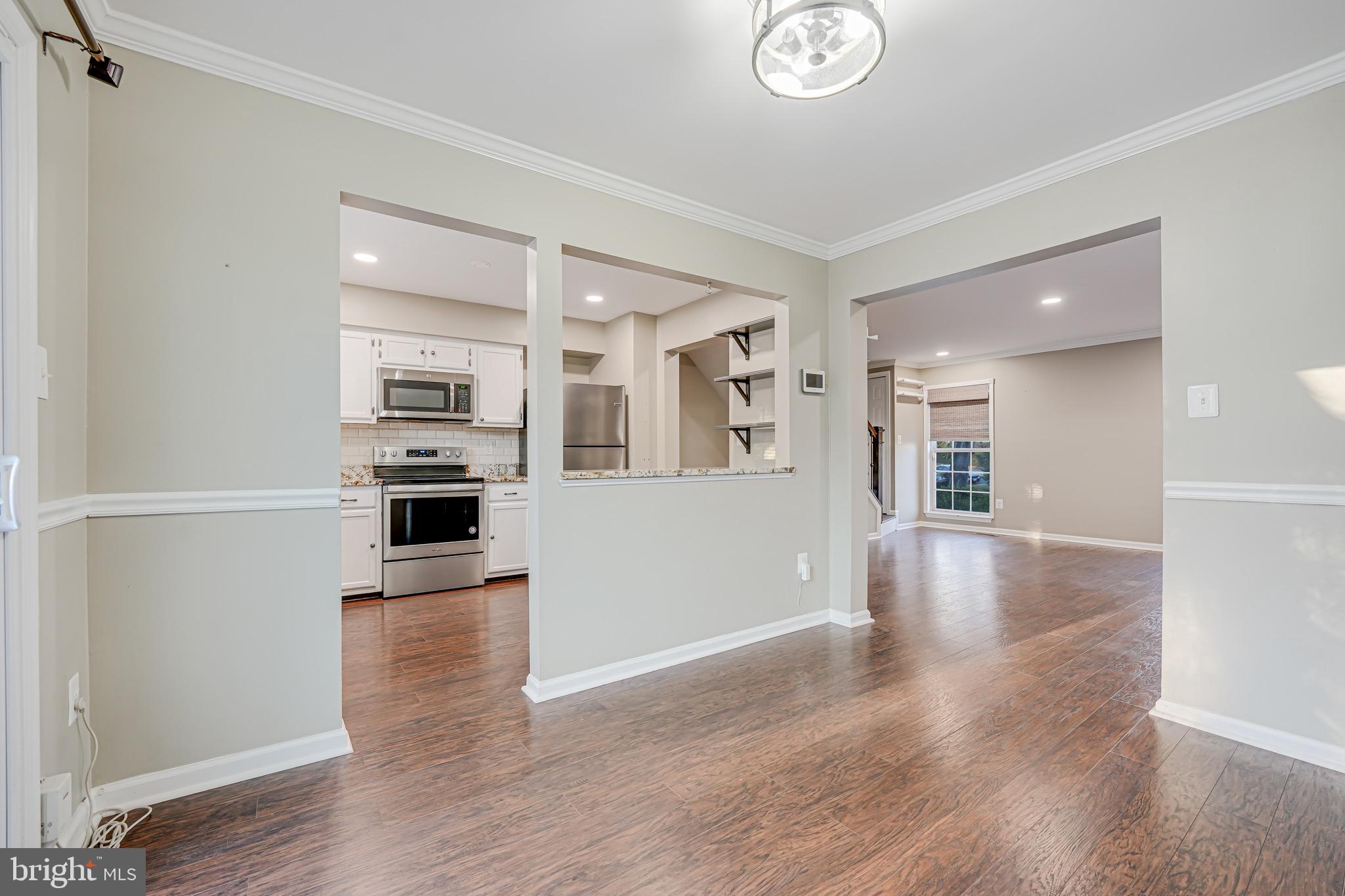 15592 Northgate Drive Dumfries, VA 22025 - Photo 7 of 51 a view of kitchen with sink microwave and stove