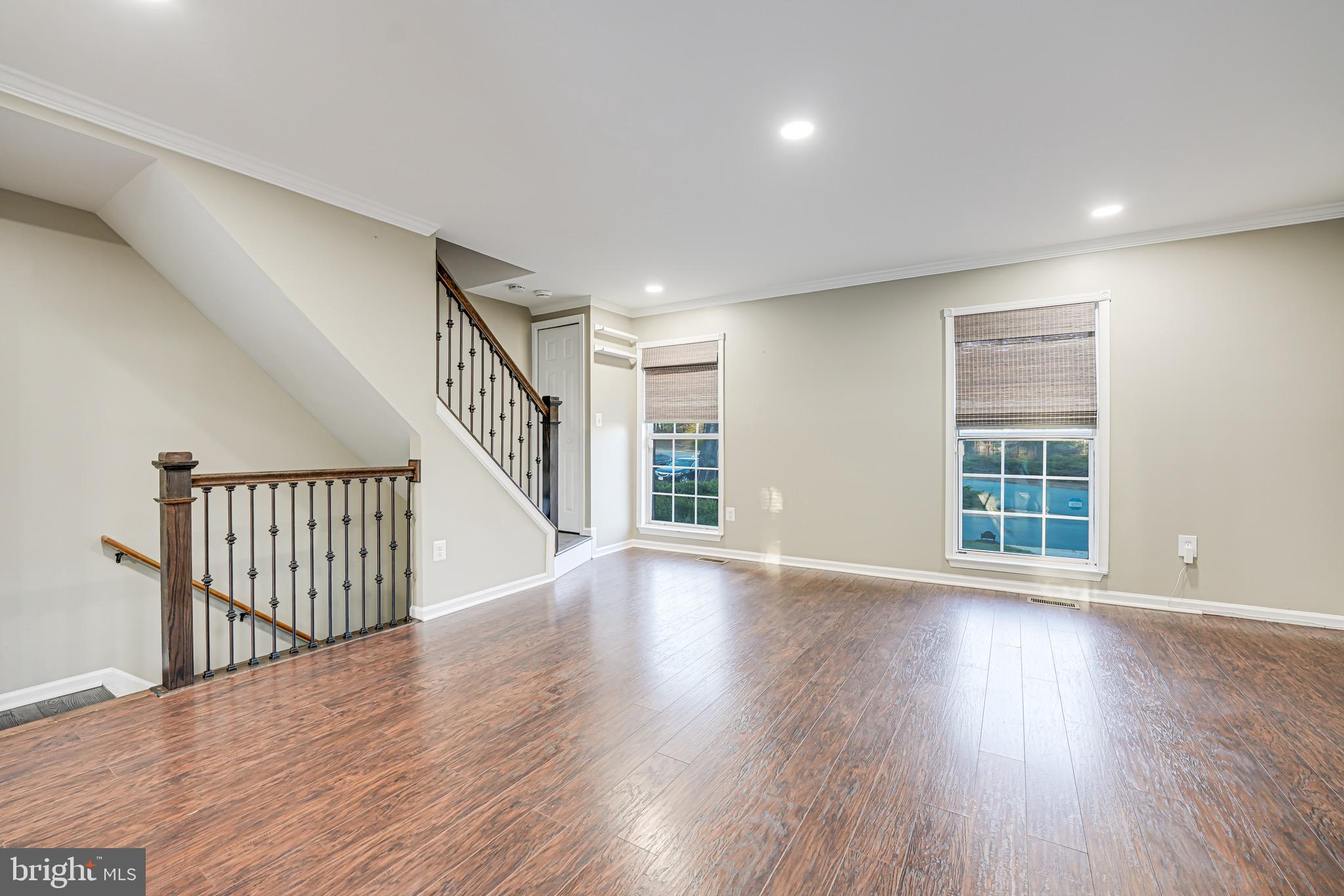 15592 Northgate Drive Dumfries, VA 22025 - Photo 9 of 51 a view of an empty room with wooden floor and a window