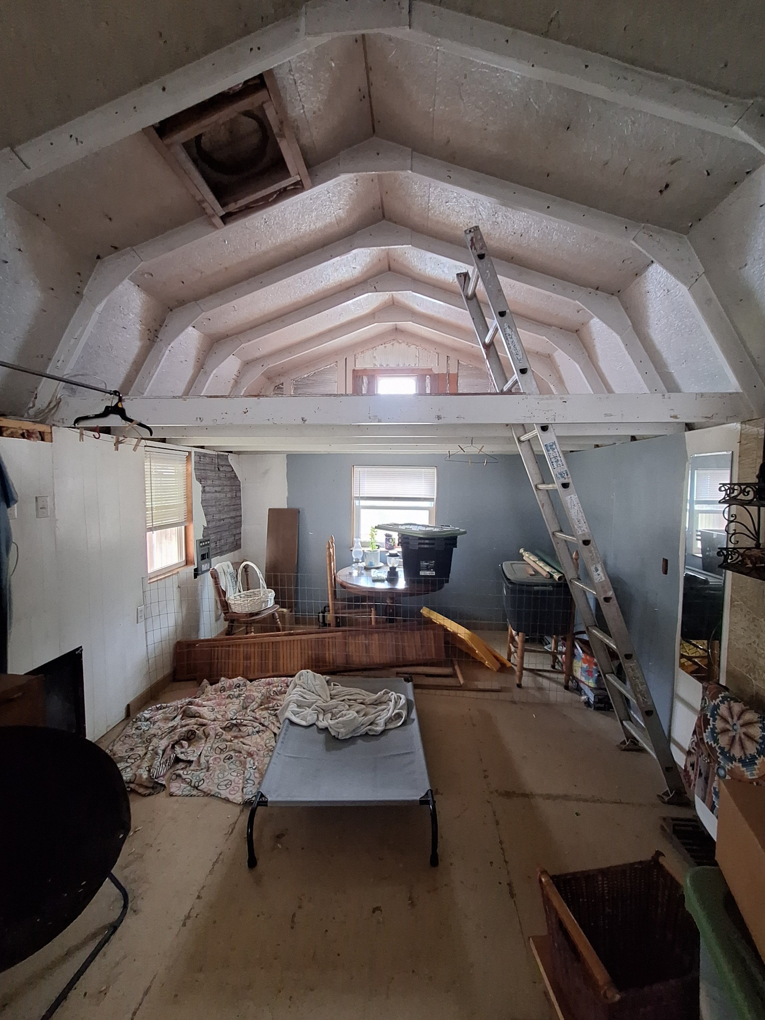 1622 Hill Chapel Road Big Sandy, TN 38221 - Photo 9 of 14 a living room with lots of furniture and gym equipment