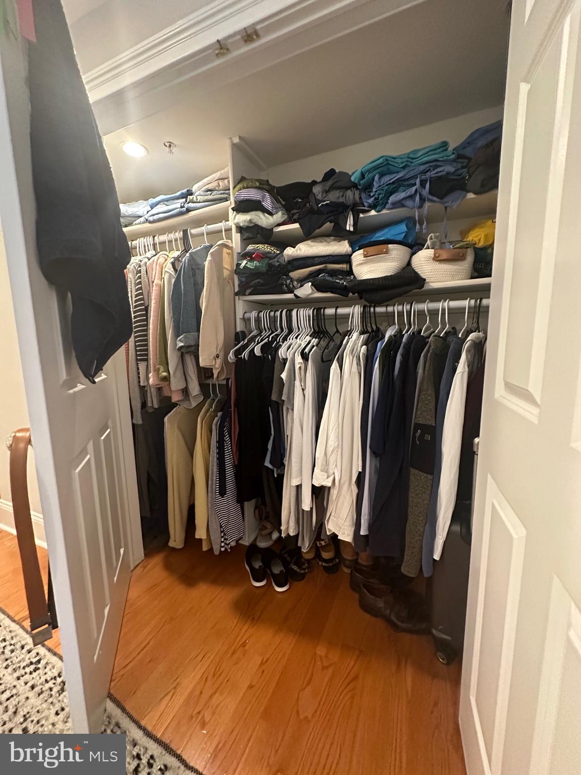 1014 Clinton Street, Unit 1R Philadelphia, PA 19107 - Photo 11 of 14 a view of walk in closet with clothes and shoes
