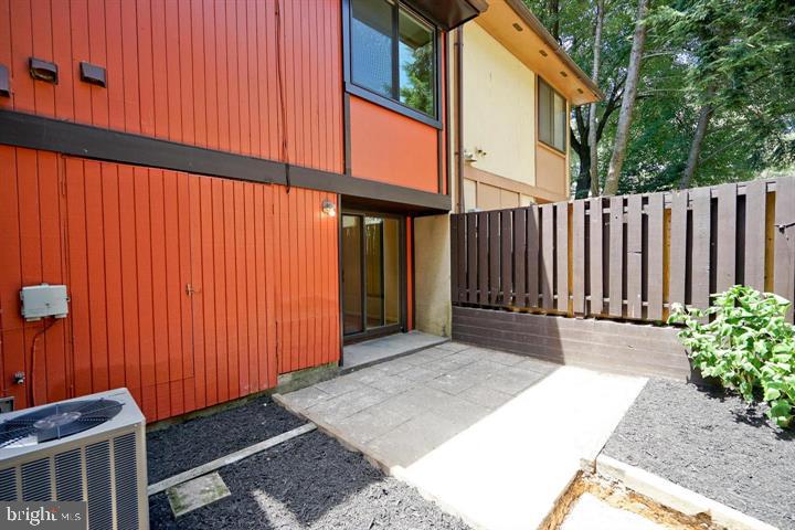 2215 Coppersmith Square Reston, VA 20191 - Photo 2 of 13 a view of backyard with tub and trees