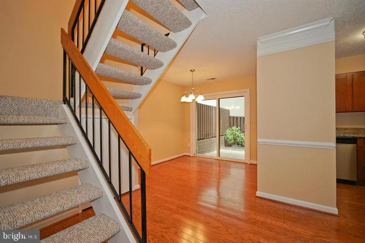 2215 Coppersmith Square Reston, VA 20191 - Photo 4 of 13 a view of an entryway with wooden floor