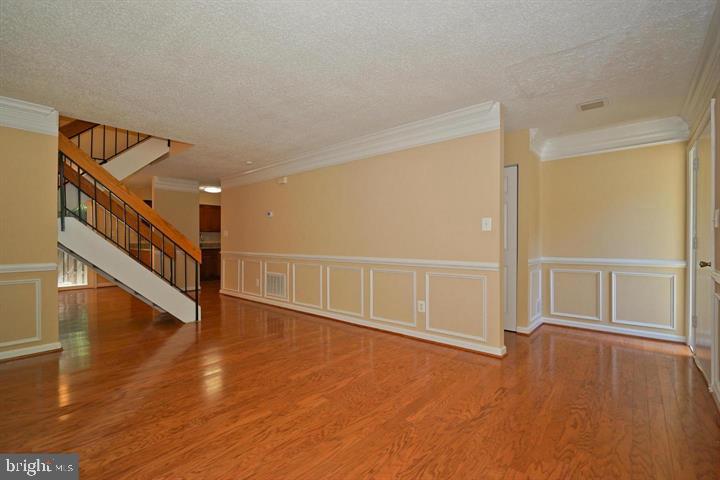 2215 Coppersmith Square Reston, VA 20191 - Photo 6 of 13 a view of an entryway with wooden floor