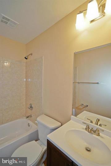 2215 Coppersmith Square Reston, VA 20191 - Photo 7 of 13 a bathroom with a sink and a bathtub